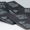 визитка на черной бумаге с применением технологии шелкография компании Арт стори