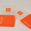 Пластиковая оранжевая визитка для компании SJ